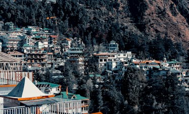 Charming hillside town nestled in the Himalayas showcasing scenic beauty and vibrant architecture.