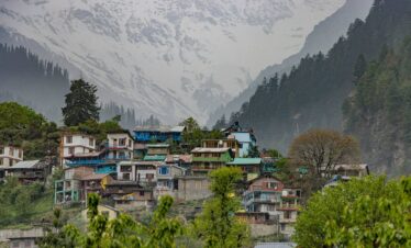 Snowy peaks and greenery around Manali